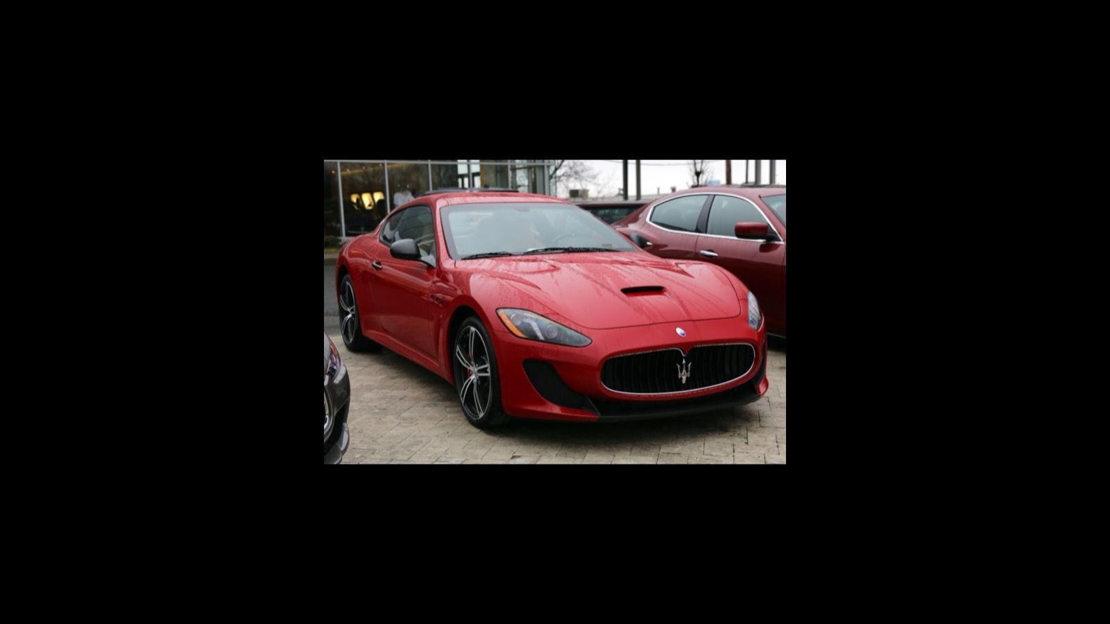 Red 2015 Maserati GranTurismo MC coupe, front three-quarter view