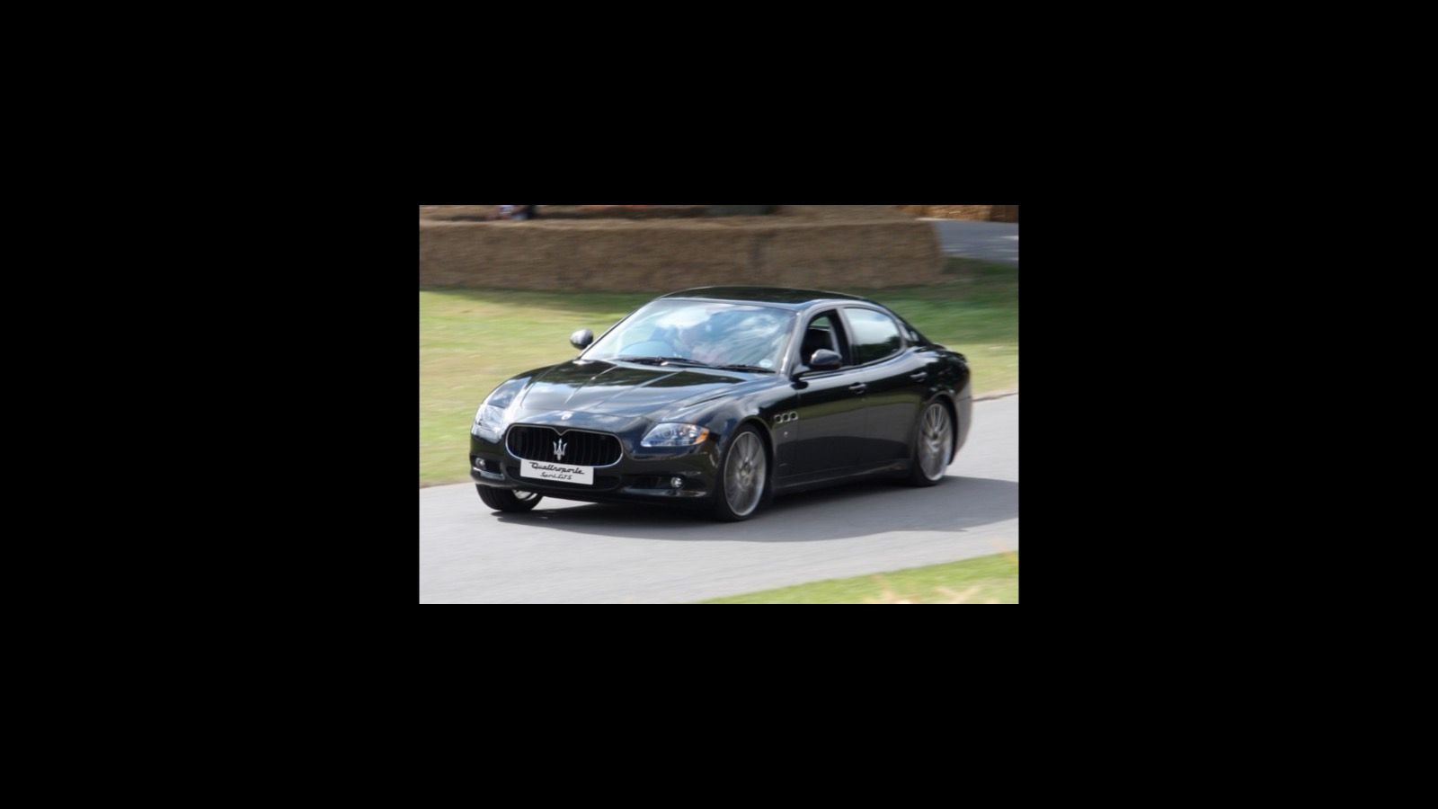Dark 2009 Maserati Quattroporte Sport GT S sedan, front three-quarter view