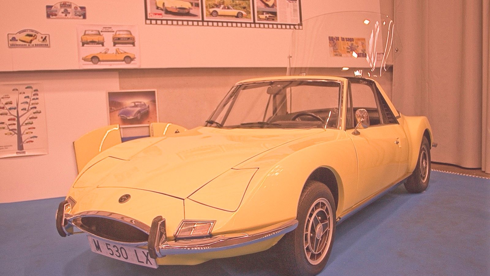 Yellow 1970 Matra 530 LX displayed indoors, front three-quarter view