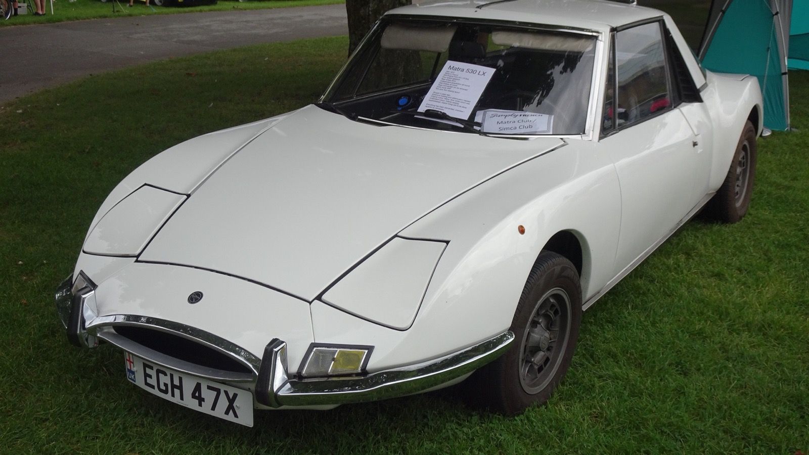 White 1972 Matra 530 LX on grass at an outdoor car show, front three-quarter view