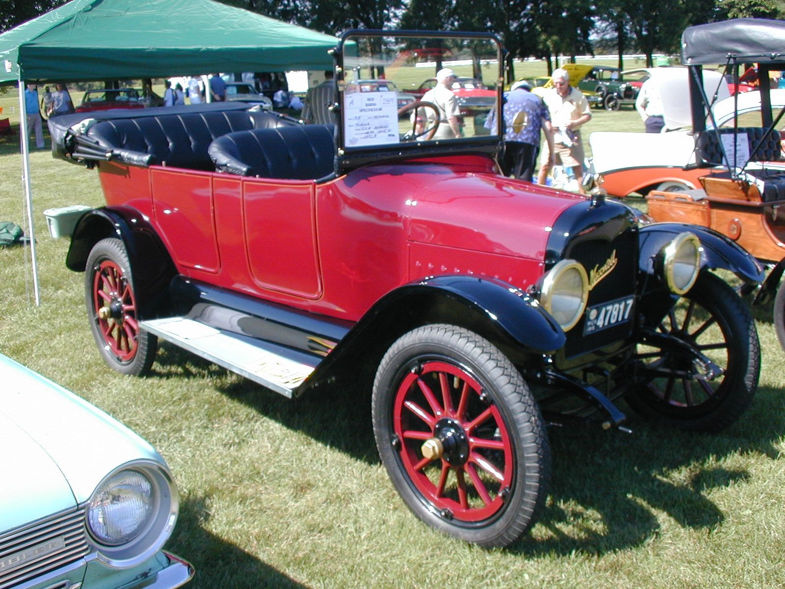 Red 1915 Maxwell touring car, front three-quarter view