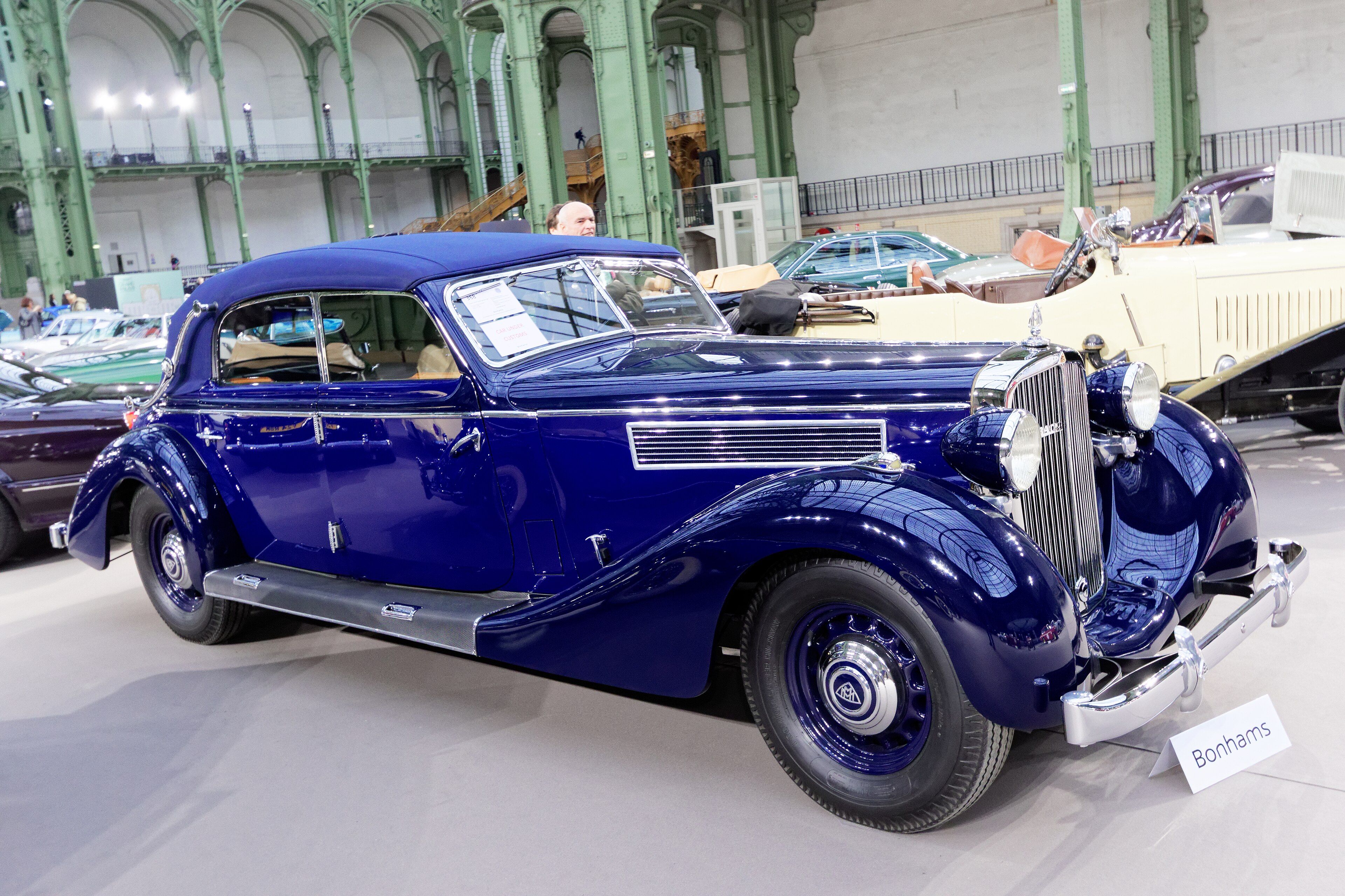 Blue 1939 Maybach SW38 Spezial cabriolet at a Paris auction preview, front three-quarter view
