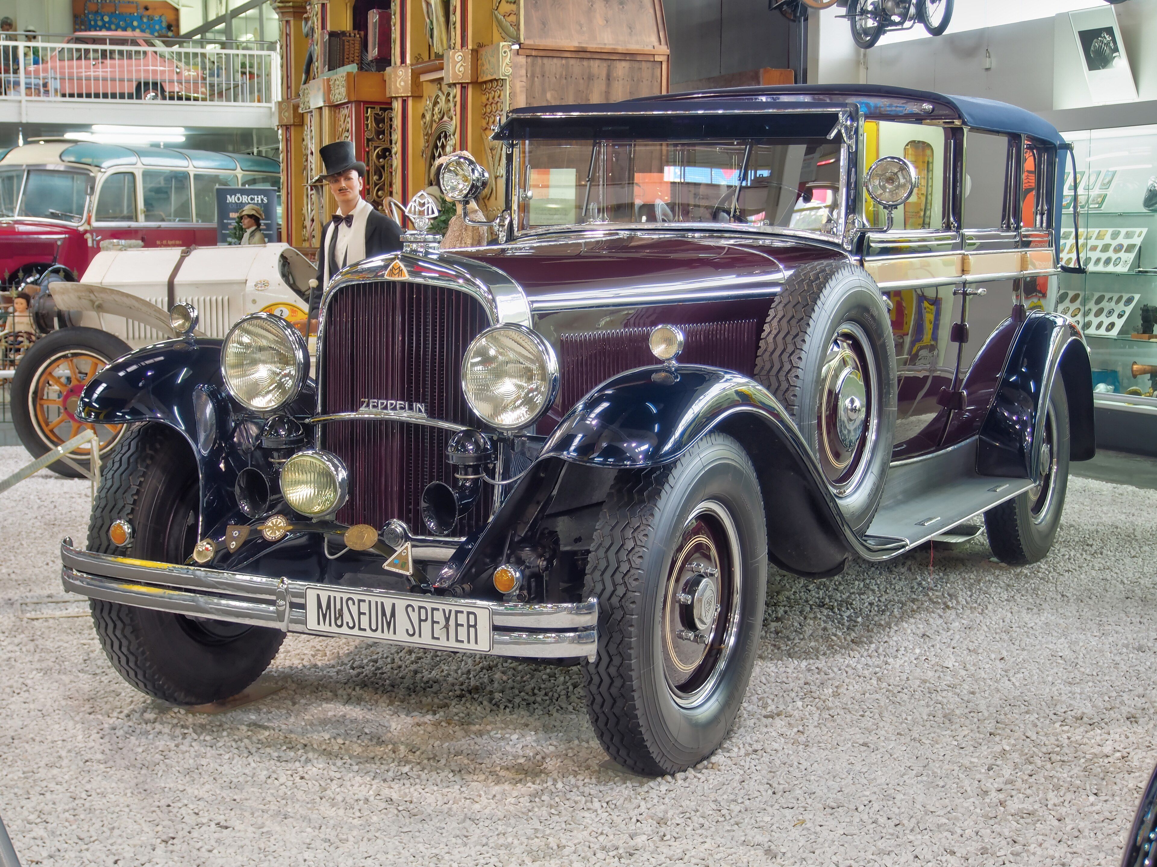 Dark 1930 Maybach DS7 Zeppelin limousine on museum display, front three-quarter view