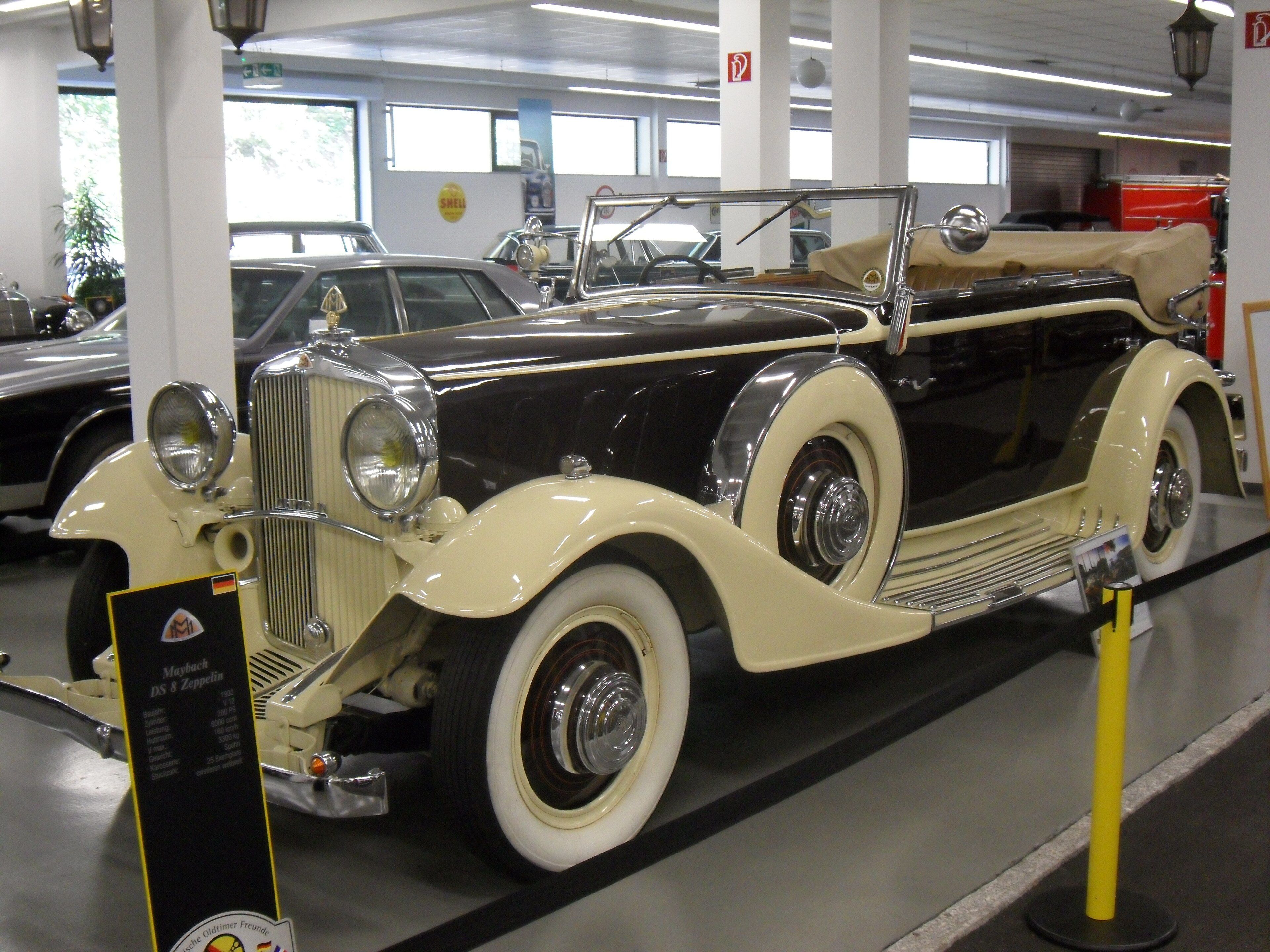Cream and black 1932 Maybach DS8 Zeppelin open tourer, front three-quarter view