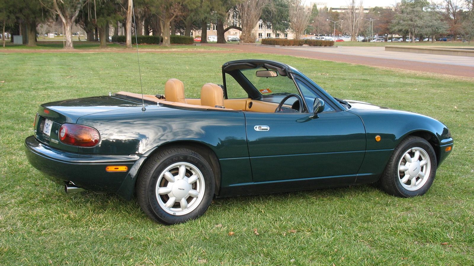 1990 Mazda MX-5 Miata, NA first generation — British Racing Green Limited Edition convertible, rear three-quarter view