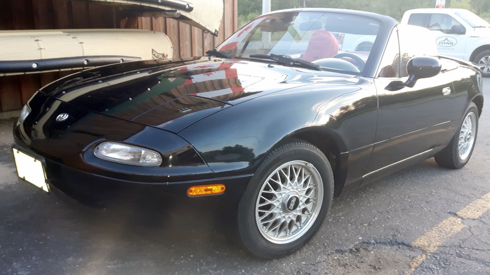 1993 Mazda MX-5 Miata Limited Edition, NA first generation — black roadster, front three-quarter view