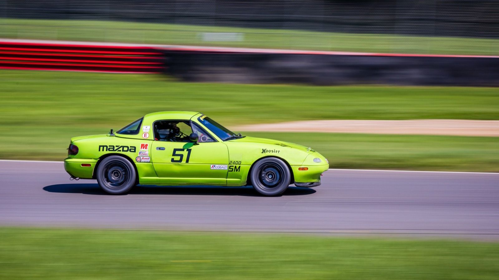 1994 Mazda MX-5 Miata, NA first generation — green Spec Miata race car, side view