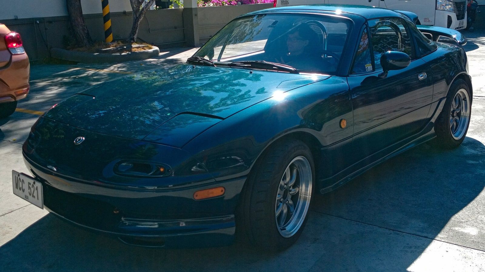 1997 Mazda MX-5 Miata, NA first generation — hardtop roadster, front three-quarter view