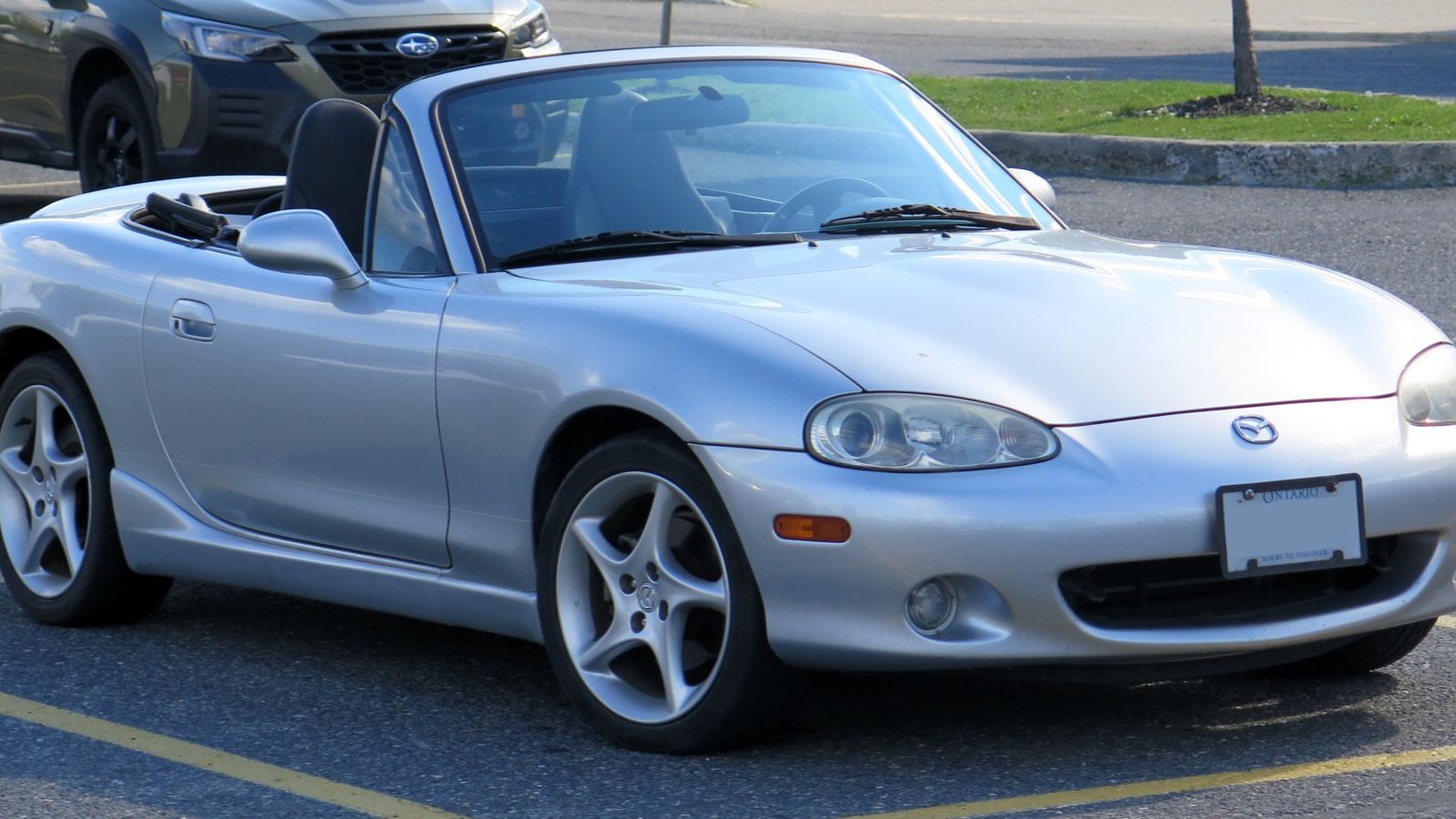 2003 Mazda MX-5 Miata, NB second generation — Sunlight Silver roadster, front three-quarter view