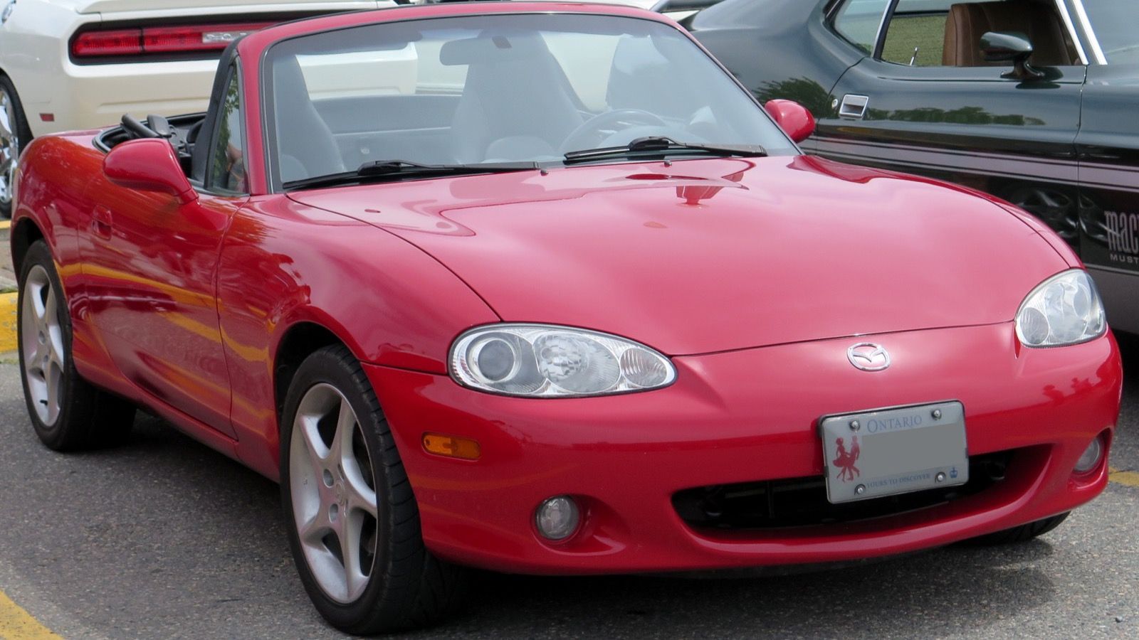 2004 Mazda MX-5 Miata, NB second generation — Classic Red roadster, front three-quarter view