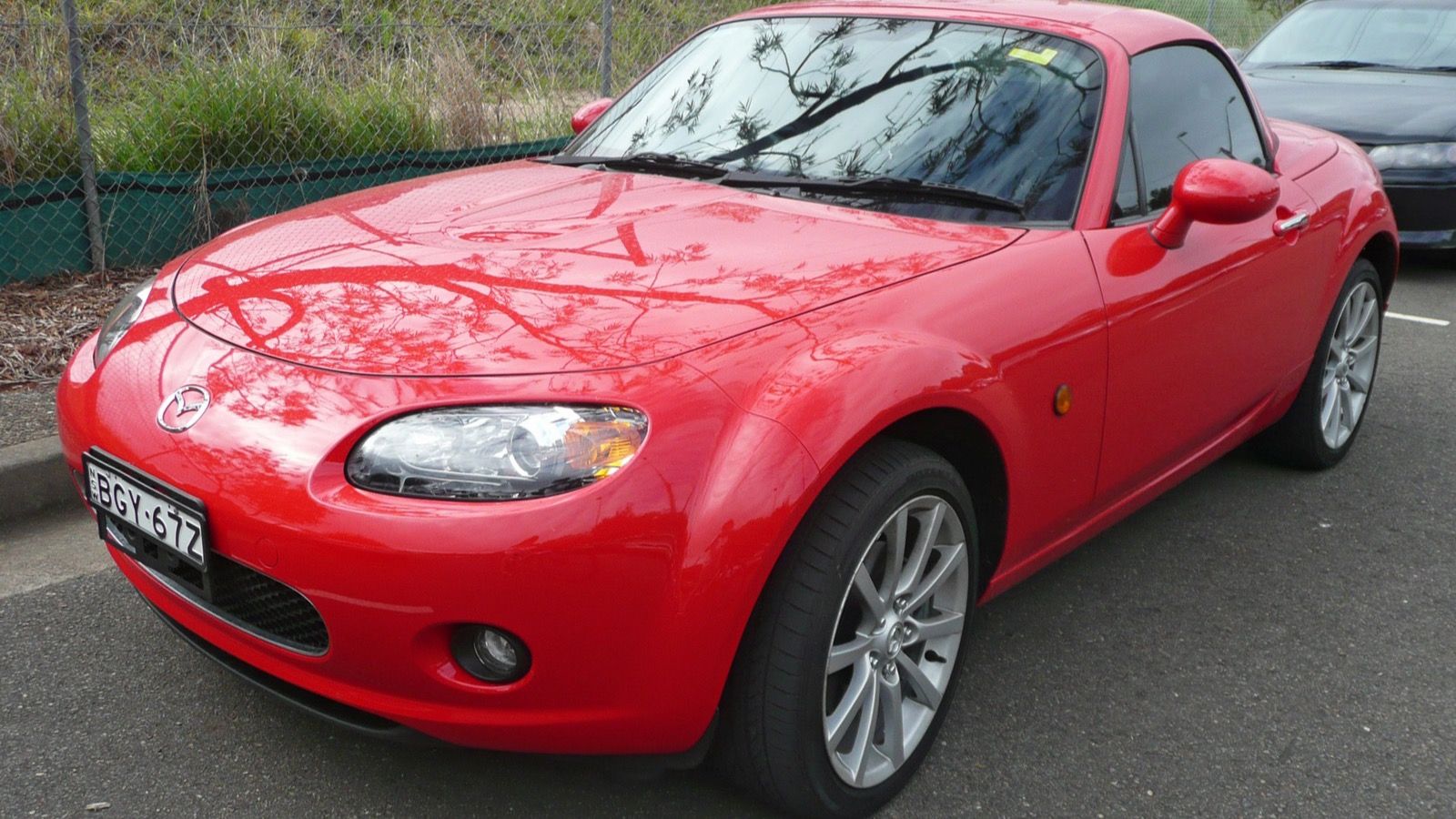 2005 Mazda MX-5 Miata, NC third generation — black hardtop coupe, front three-quarter view