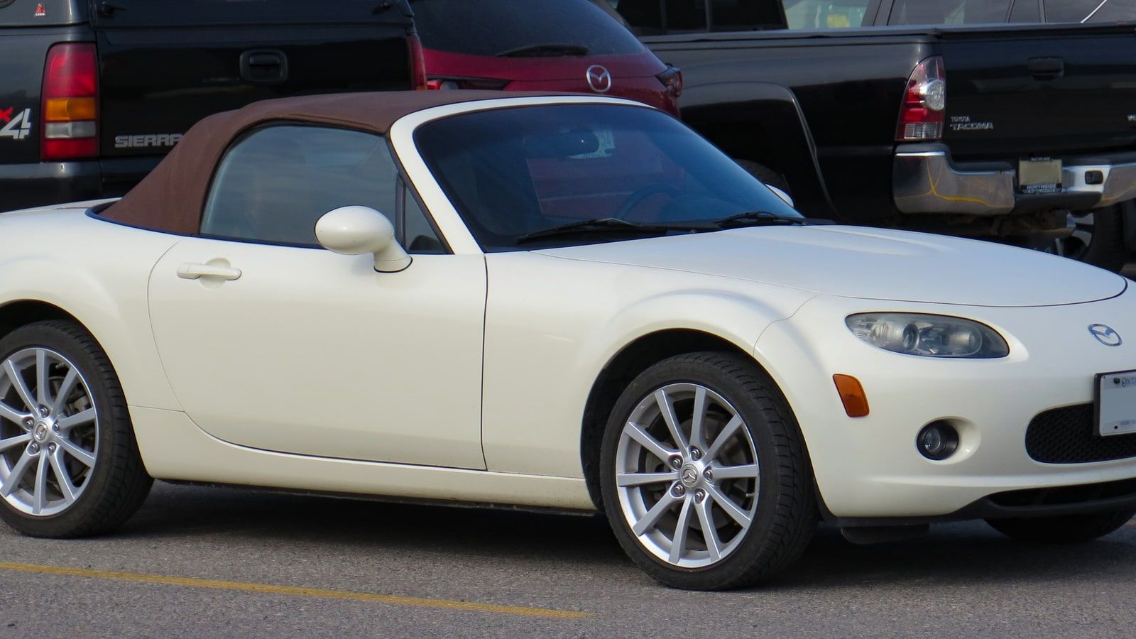2006 Mazda MX-5 Miata Grand Touring, NC third generation — white roadster, front three-quarter view