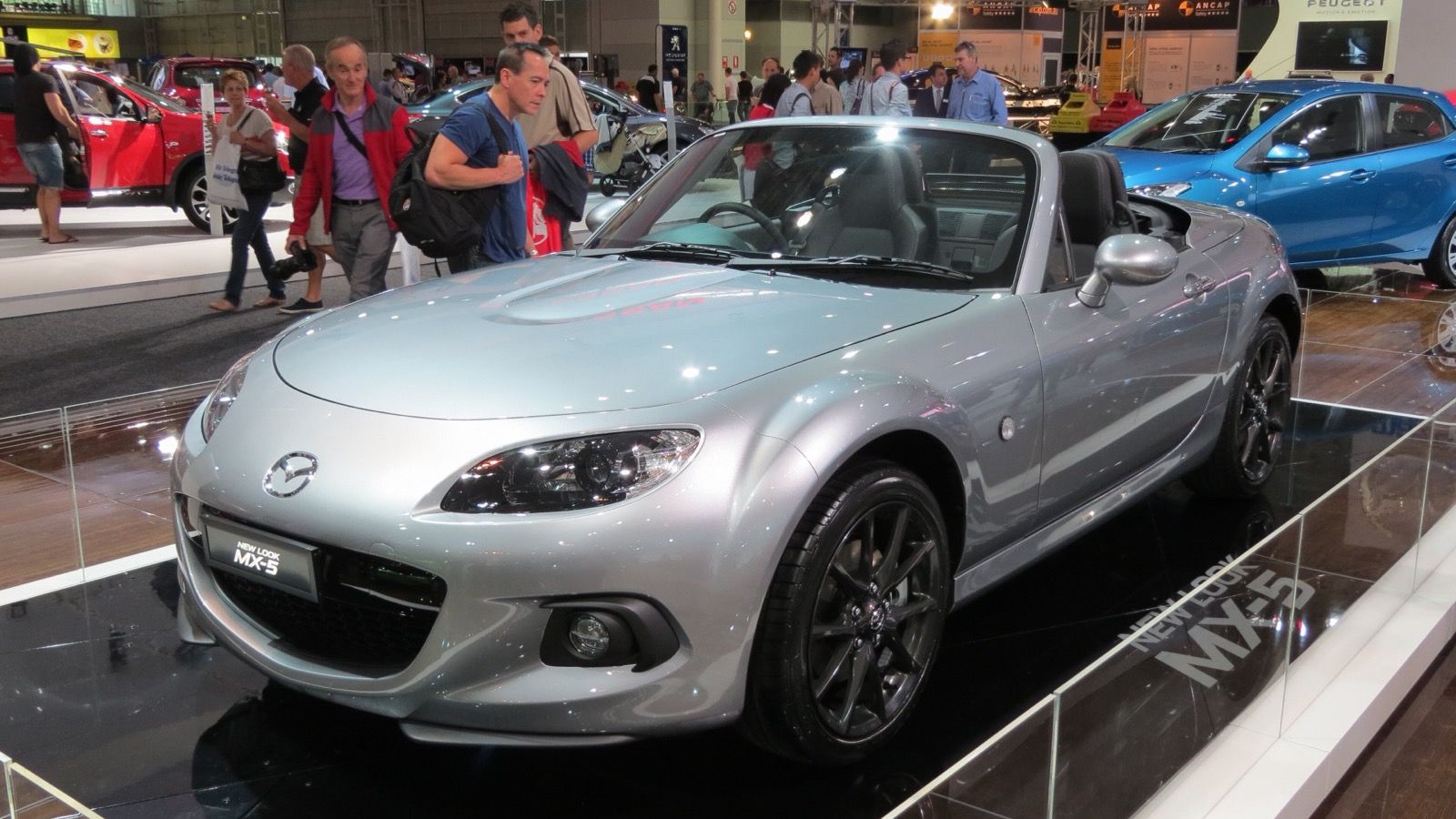 2012 Mazda MX-5 Miata, NC third generation — silver hardtop coupe, front three-quarter view