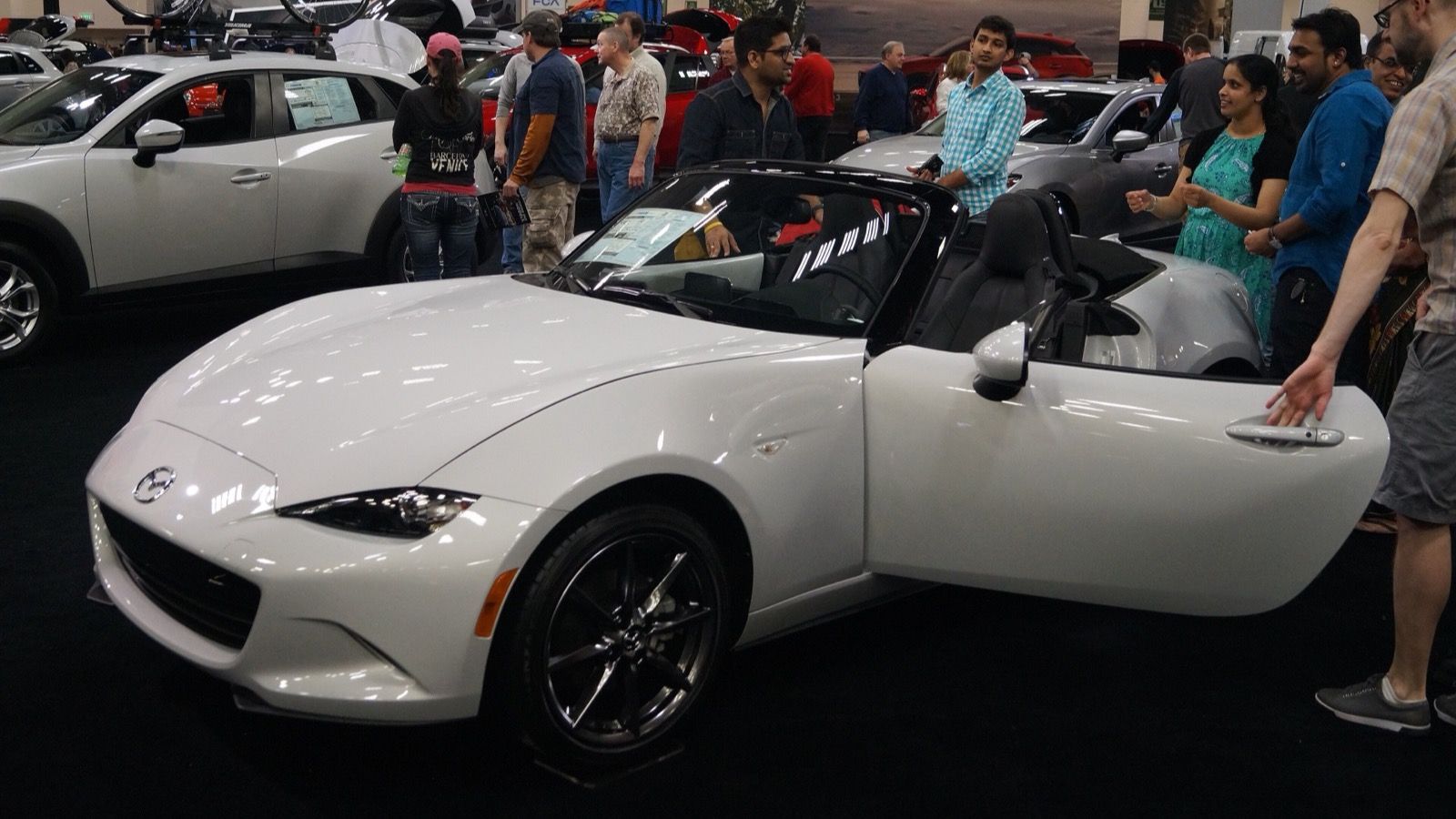 2016 Mazda MX-5 Miata, ND fourth generation — white roadster at an auto show, front three-quarter view