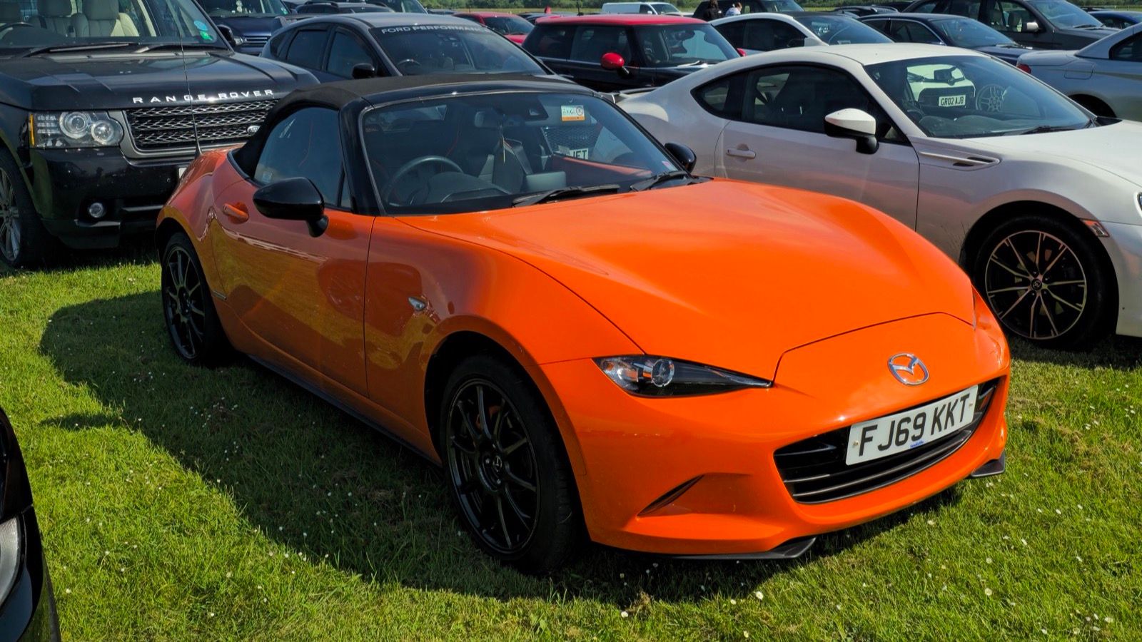 Fourth-generation Mazda MX-5 Miata (ND) — Racing Orange 30th Anniversary Edition, front three-quarter view