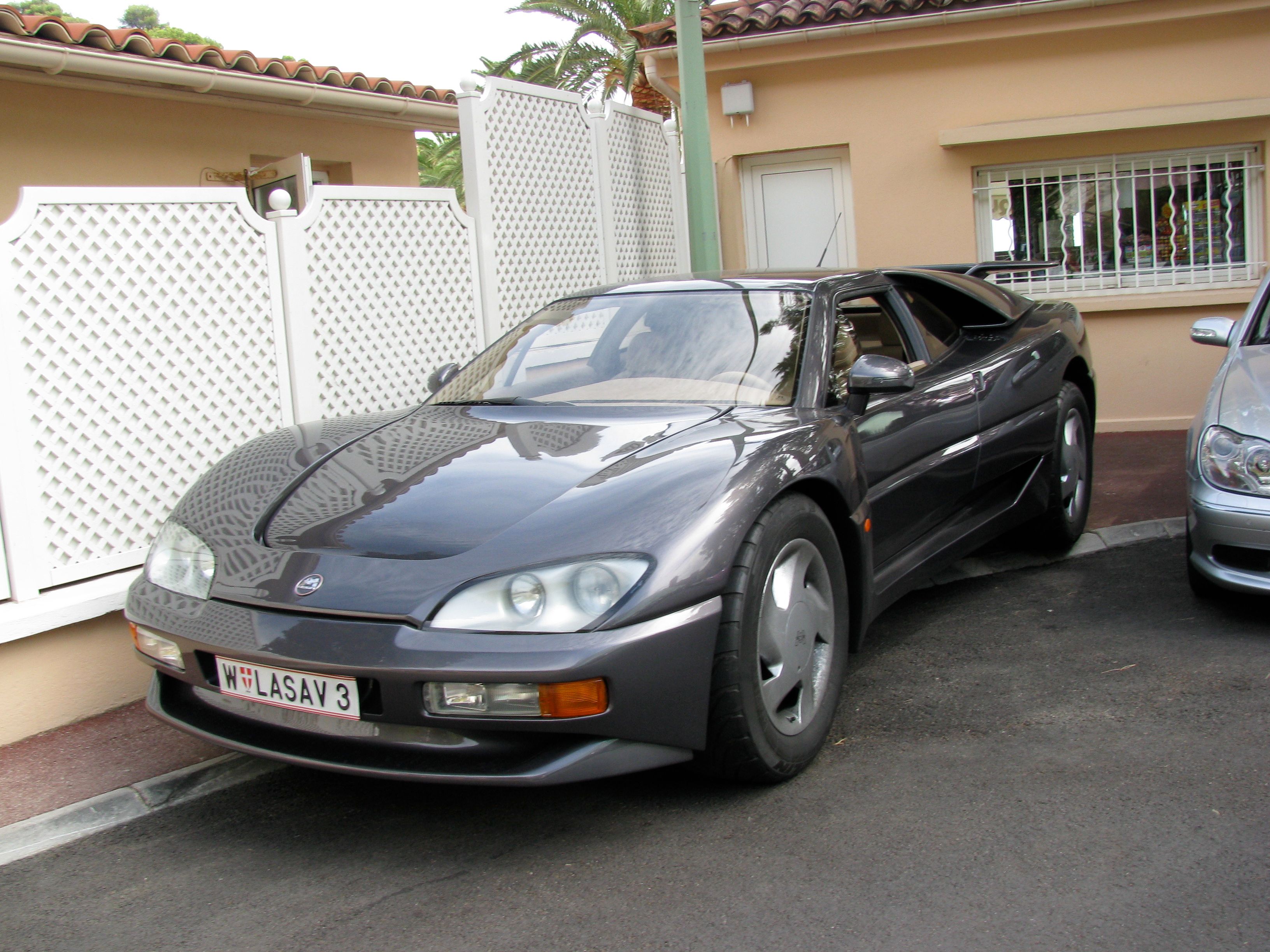 Grey Mega Track supercar, front three-quarter view