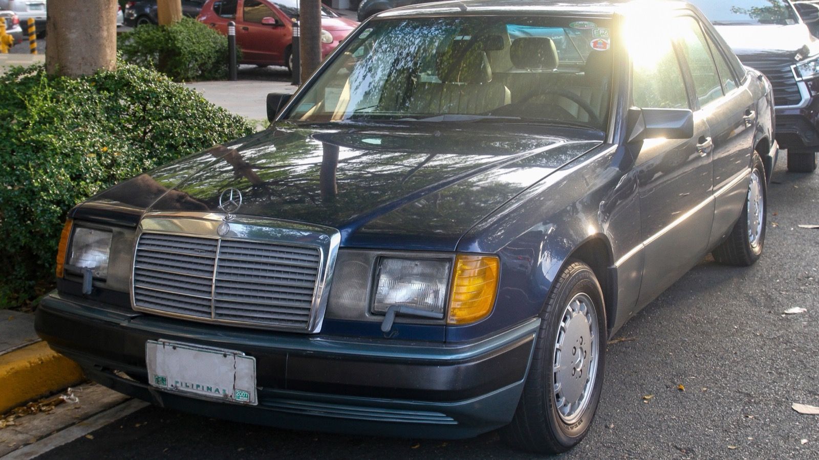 1991 Mercedes-Benz W124 300E 2.6 in Nautical Blue, front left, front three-quarter view