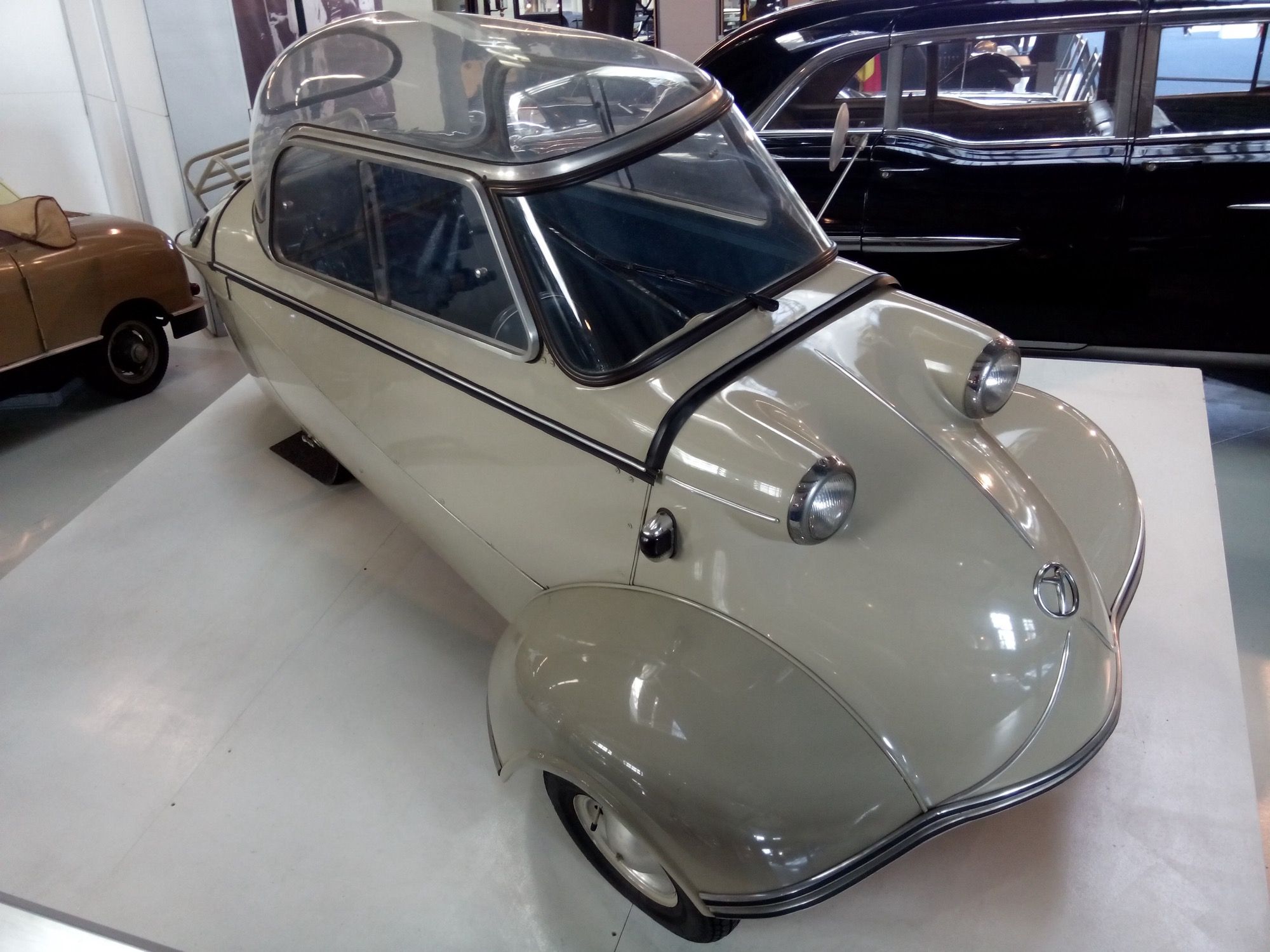 Cream 1955 Messerschmitt KR200 tandem-seat bubble car, front three-quarter view