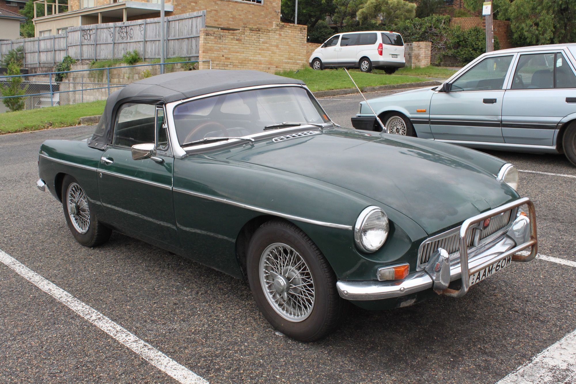 Dark green 1963 MG B Mk1 roadster, front three-quarter view