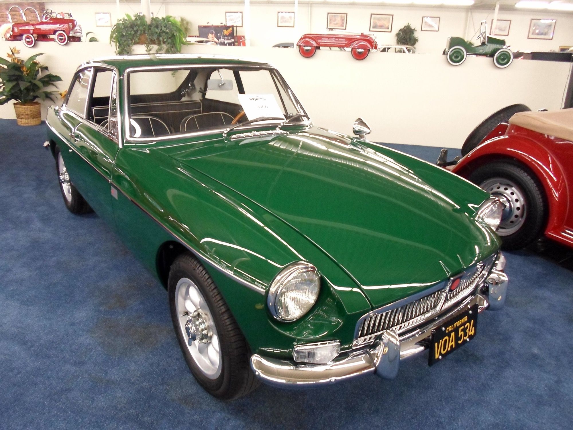 Green 1967 MG B GT coupe, front three-quarter view