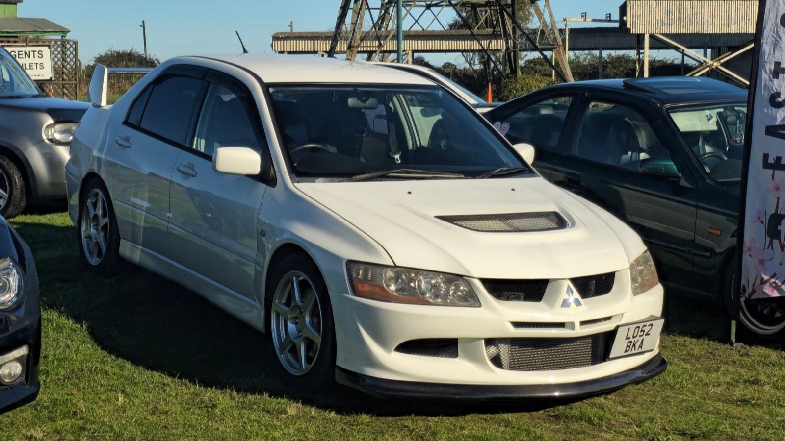 White 2003 Mitsubishi Lancer Evolution VIII FQ-300 sedan, front three-quarter view