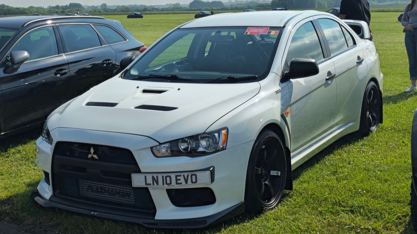 White 2012 Mitsubishi Lancer Evolution X FQ-400 sedan, front three-quarter view
