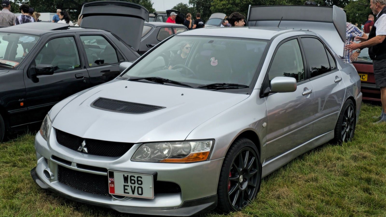 Silver Mitsubishi Lancer Evolution IX FQ-340 sedan, front three-quarter view
