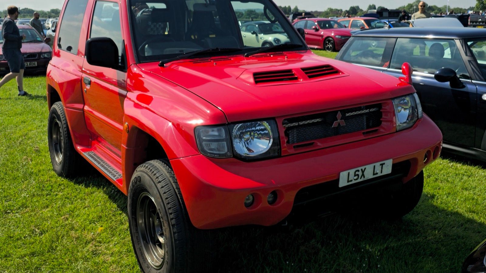 Red 1998 Mitsubishi Pajero Evolution three-door off-roader, front three-quarter view