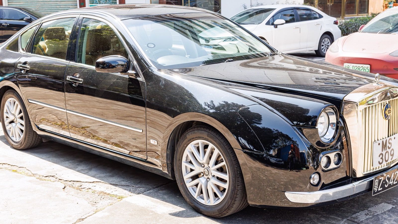 Third-generation Mitsuoka Galue in black, front three-quarter view