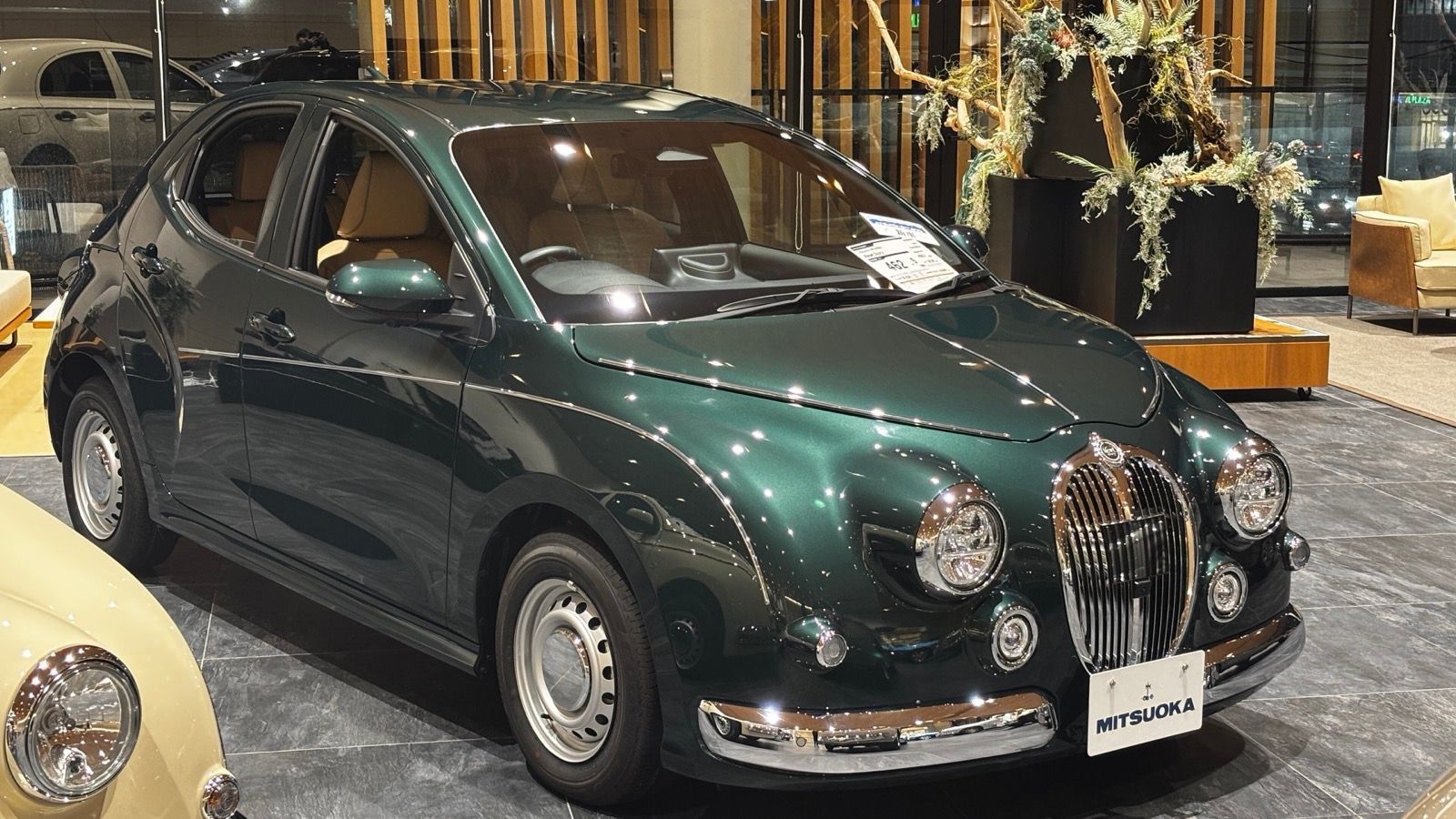 2025 Mitsuoka Viewt Story 10DX Royal Edition in dark green, front three-quarter view