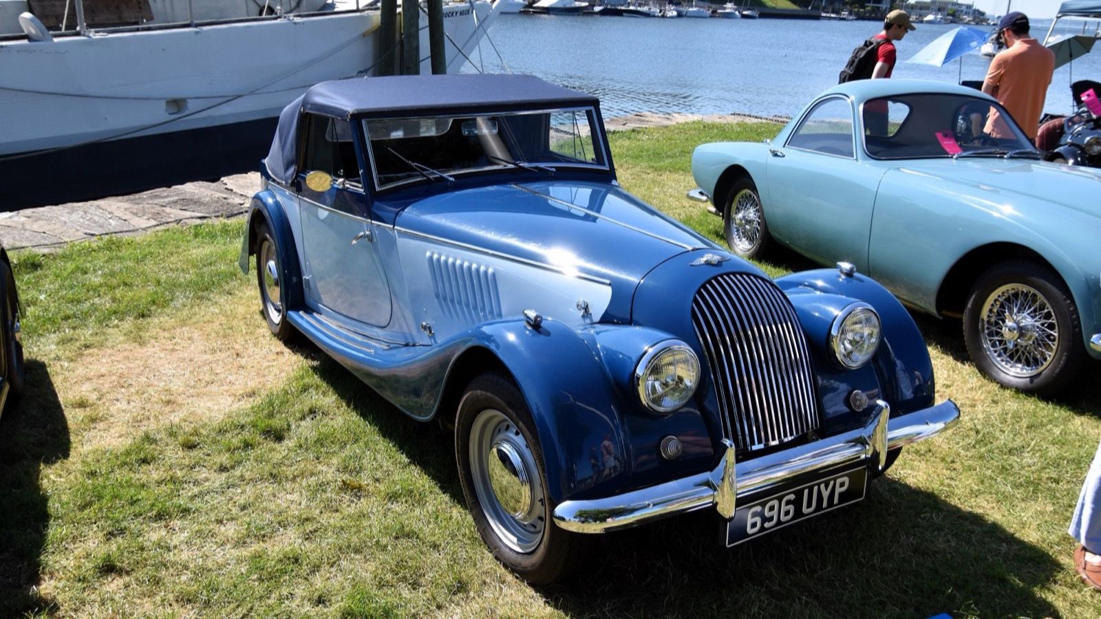 Two-tone blue 1956 Morgan Plus 4 drophead coupé with hood raised, front three-quarter view