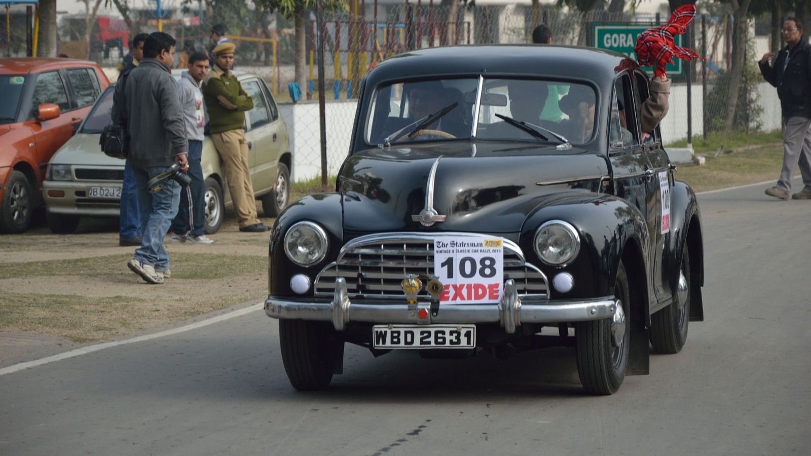 Black 1951 Morris Oxford Series MO saloon on a road rally, front three-quarter view