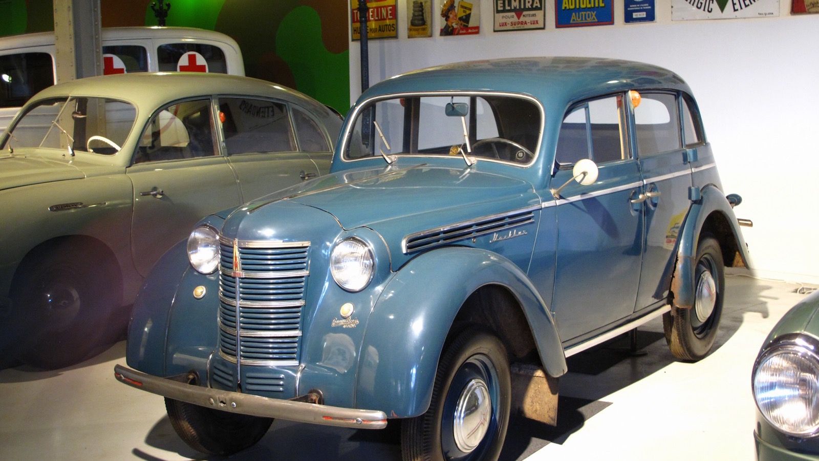 Blue 1951 Moskvitch 400 four-door sedan, front three-quarter view