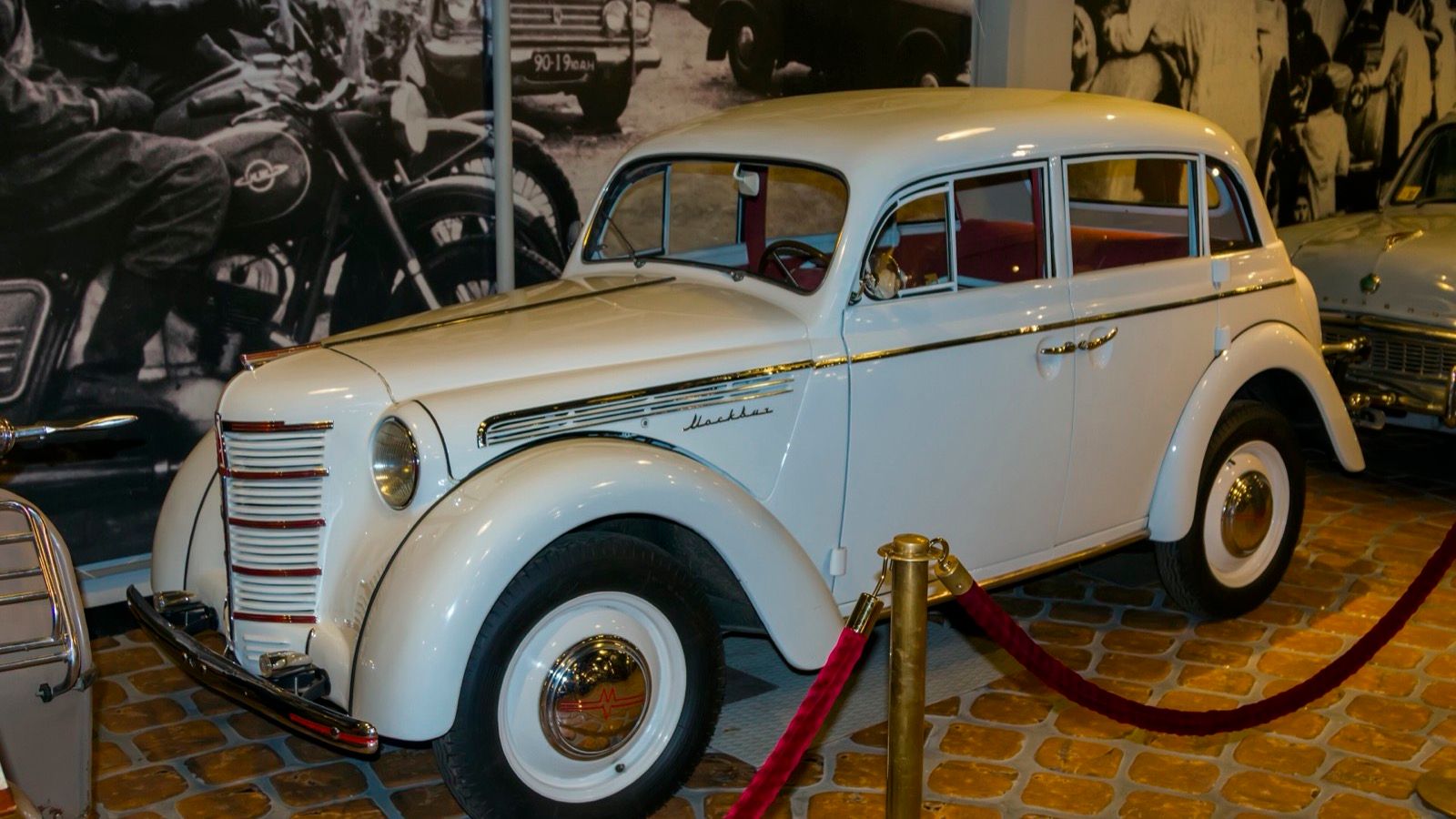 White Moskvitch 401 sedan on museum display, front three-quarter view