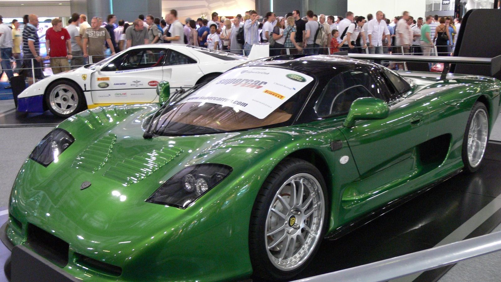 Green Mosler MT900 at the 2006 British International Motor Show, front three-quarter view