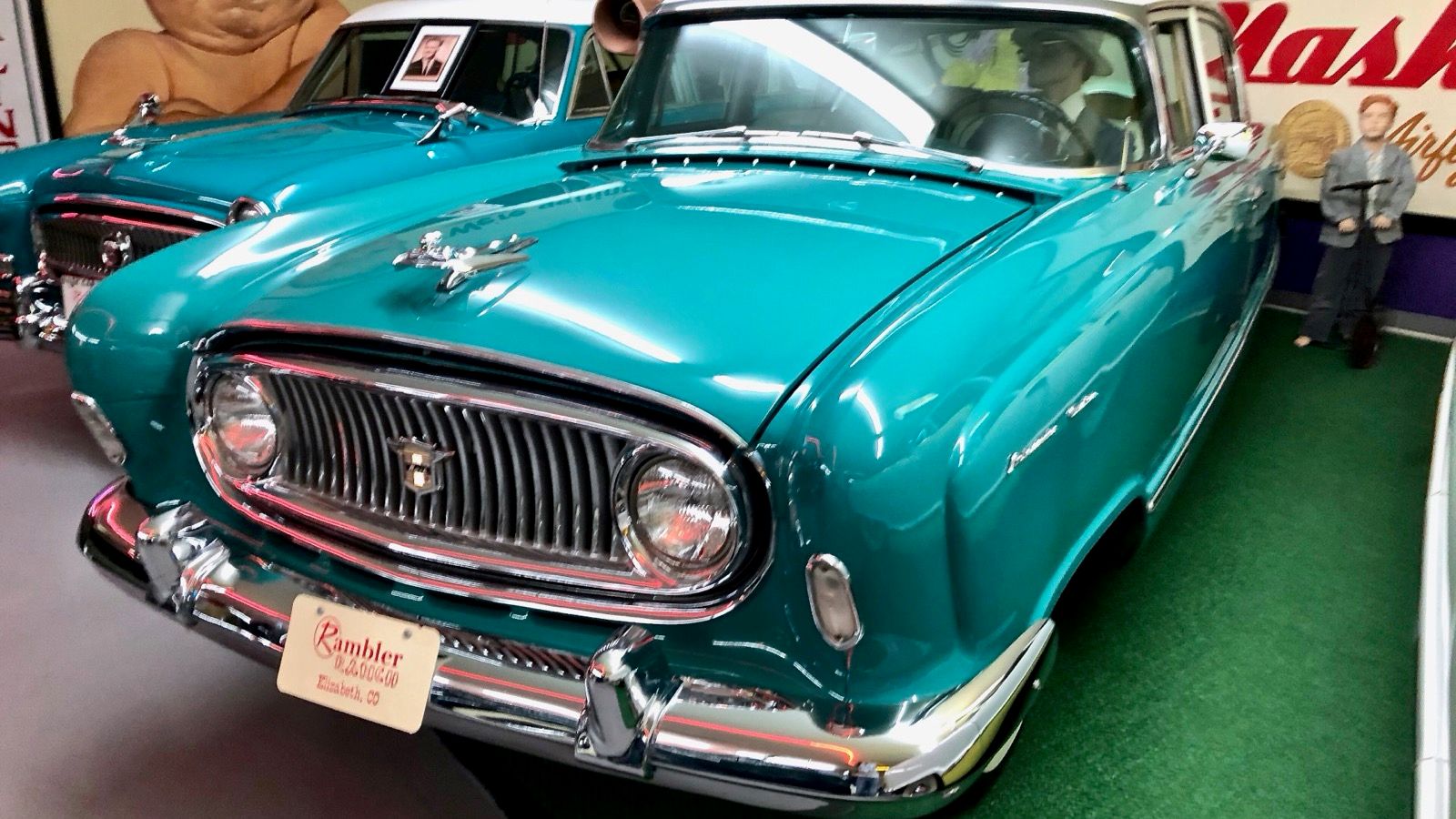 Turquoise and white 1955 Nash Ambassador Custom four-door sedan, front three-quarter view at the Rambler Ranch collection