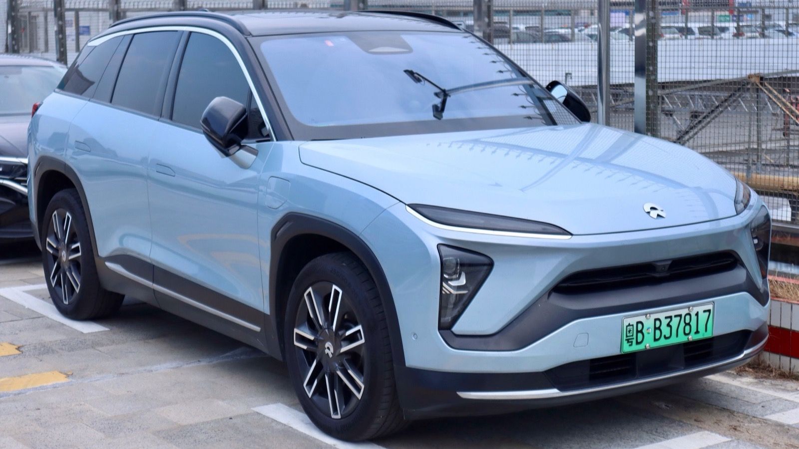 Light blue 2019 NIO ES6 parked in a bay, front three-quarter view