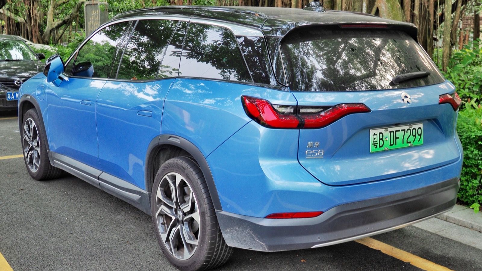 Blue 2018 NIO ES8 parked at a kerb, rear three-quarter view