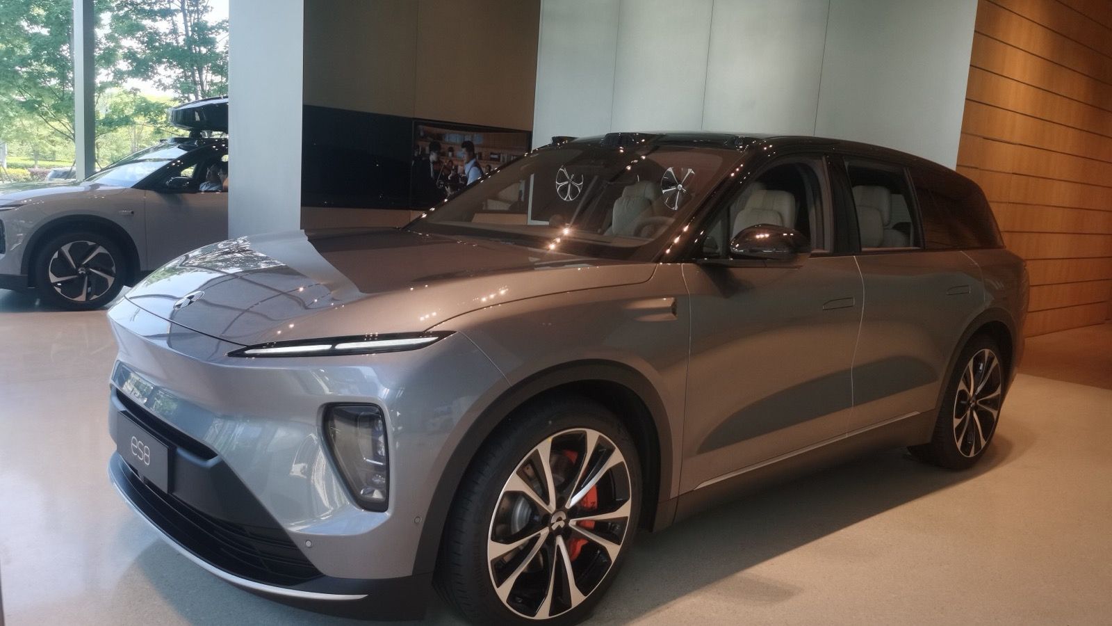 Grey 2024 NIO ES8 at NIO House Suzhou Center, front three-quarter view