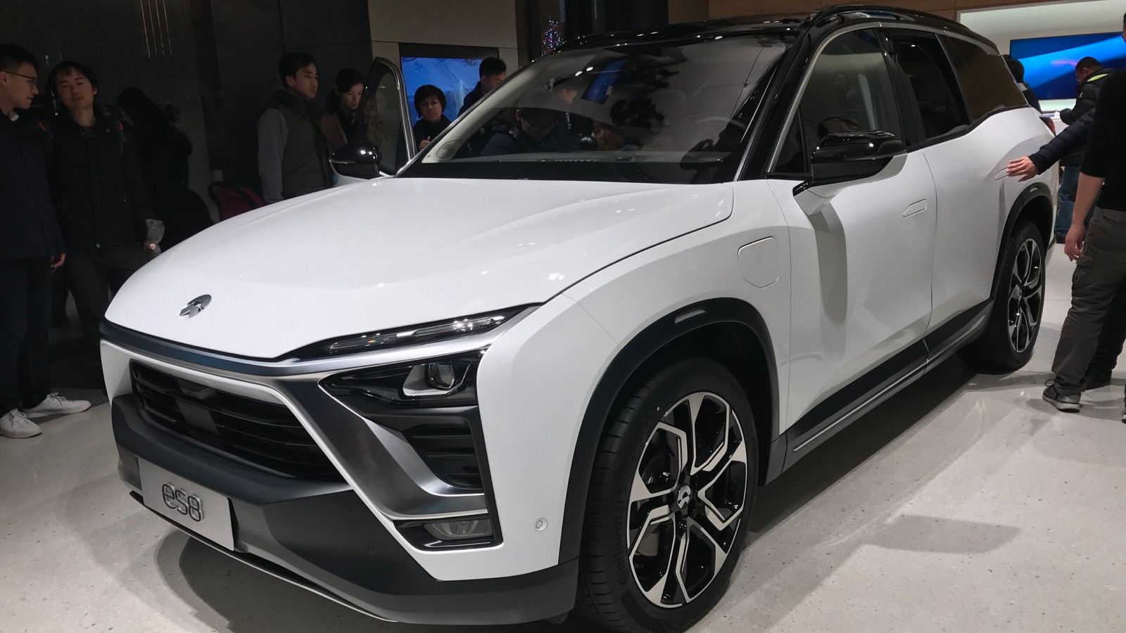 White first-generation NIO ES8 on display, front three-quarter view