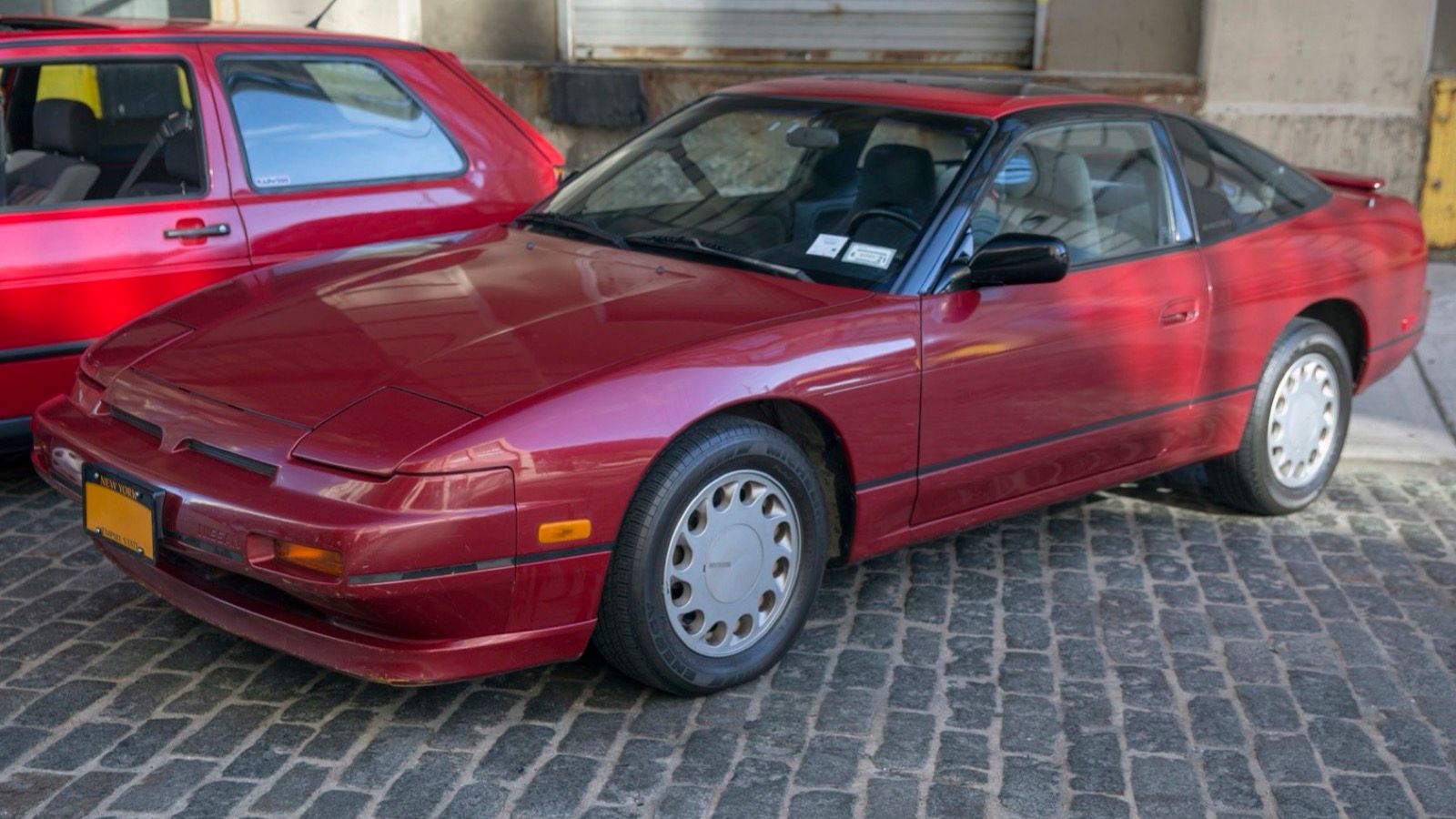 Red 1989 Nissan 240SX SE hatchback, front three-quarter view