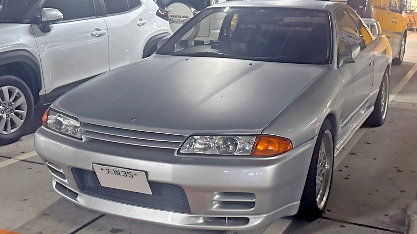 Silver Nissan Skyline GT-R (R32), front three-quarter view