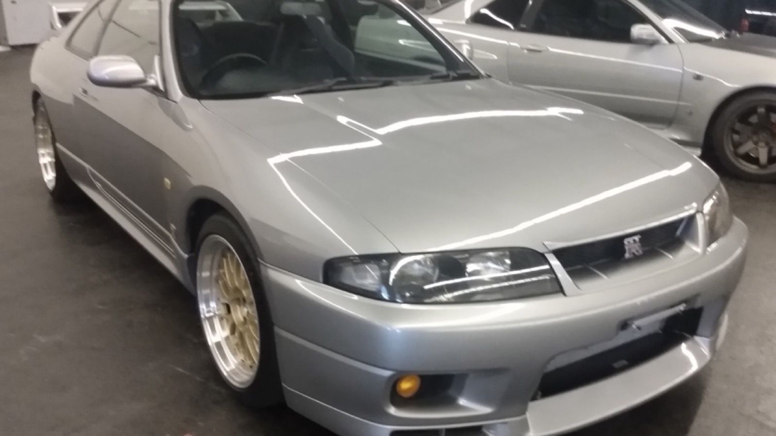 Silver 1995 Nissan Skyline GT-R (R33), front three-quarter view