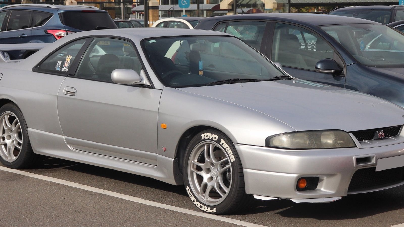 Silver Nissan Skyline GT-R (R33) coupe, front three-quarter view