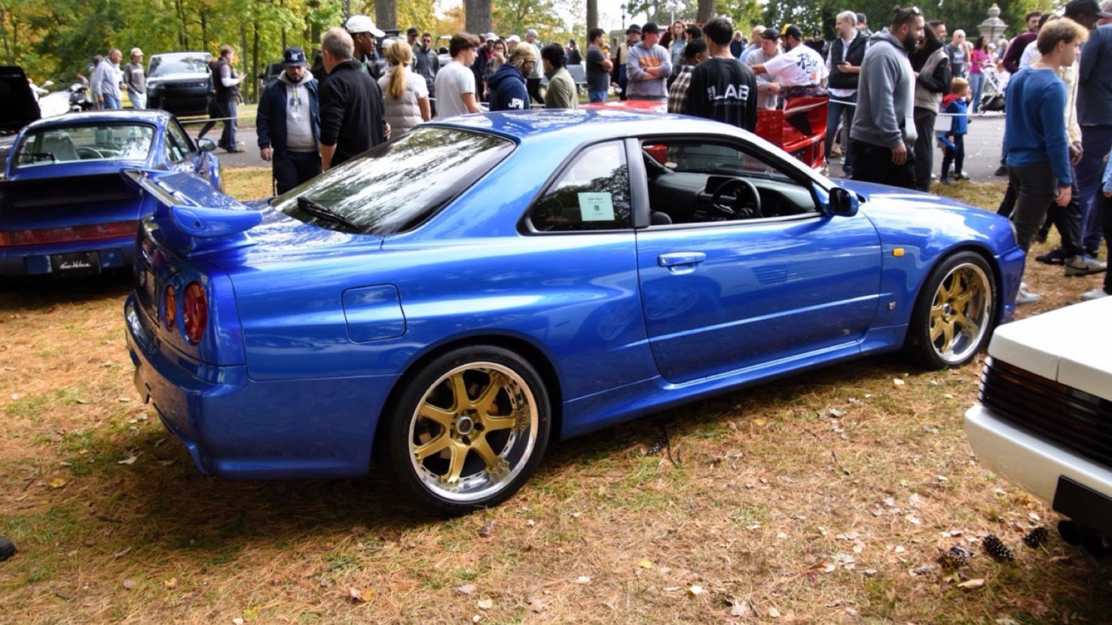 Blue 1999 Nissan Skyline GT-R V-Spec (R34), rear three-quarter view