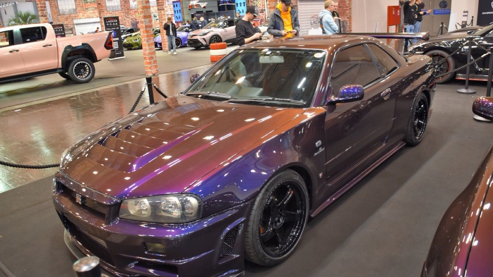 Midnight Purple Nissan Skyline GT-R V-Spec (R34), front three-quarter view
