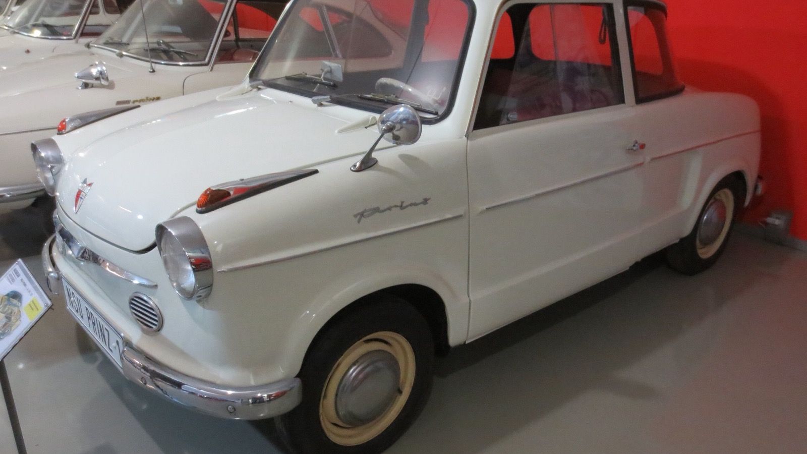 NSU Prinz I in cream, front three-quarter view on museum display