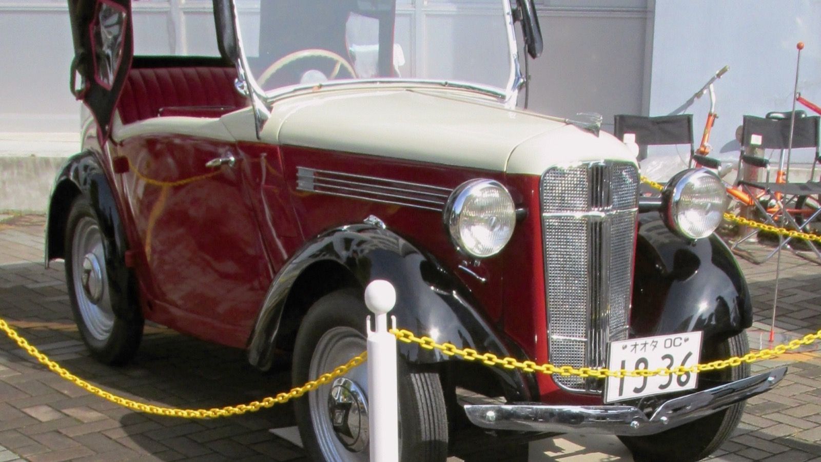 1936 Ohta Type OC phaeton on outdoor display in Japan, close front three-quarter view showing the vertical-bar grille