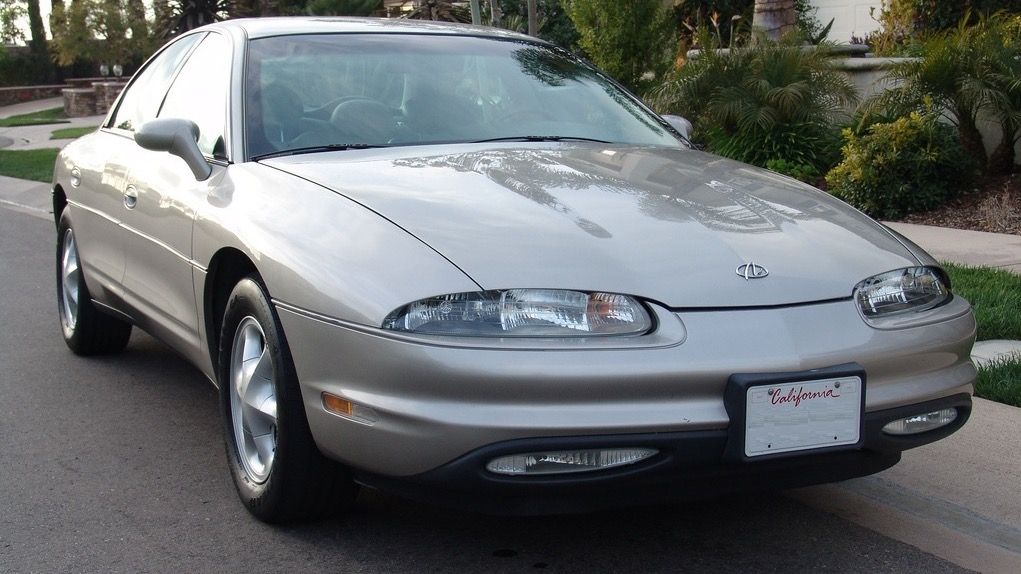Beige 1997 Oldsmobile Aurora sedan, front three-quarter view