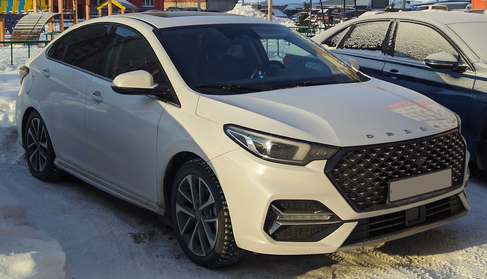 White 2023 Omoda S5 Ultra sedan, front three-quarter view
